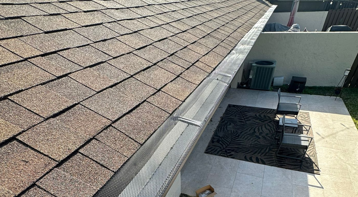 Commercial building exterior with a metal gutter and downspout system in Orange County